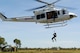 U.S. Air Force Tech. Sgt. Layla Dispense, 90th Fighter Squadron Independent Duty Medical Technician, is lowered from a helicopter by a winch during helicopter rescue training at RAAF Base Tindal, Feb. 28, 2017. Dispense is deployed to Australia as part of the Enhanced Air Cooperation, a joint training and exercise initiative under the Force Posture Agreement between the U.S. and Australian governments. (U.S. Air Force photo by Staff Sgt. Alexander Martinez)