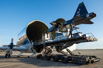 A T-38 Talon is unloaded from a B-377 Super Guppy March 3, 2017, at Joint Base San Antonio-Randolph, Texas. The Super Guppy has a hinged nose that opens 110 degrees, allowing full frontal cargo loading.
