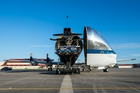 A T-38 Talon is unloaded from a B-377 Super Guppy March 3, 2017, at Joint Base San Antonio-Randolph, Texas. The Super Guppy has a hinged nose that opens 110 degrees, allowing full frontal cargo loading.
