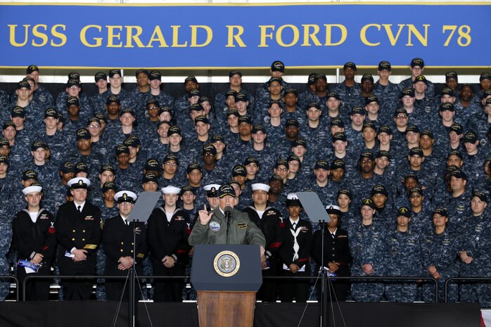 President Donald J. Trump speaks with Sailors in the hangar bay aboard Pre-Commissioning Unit Gerald R. Ford (CVN 78). Trump visited March 2 to meet with Sailors and shipbuilders of the Navy's first-in-class aircraft carrier during an all-hands call inside the ship's hangar bay. 