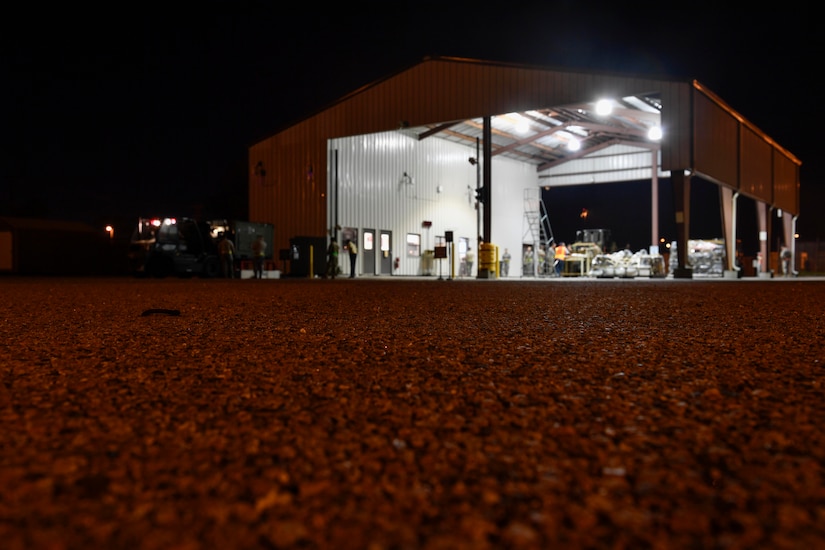 Members of the 437th Aerial Port Squadron and 628th Civil Engineer Squadron Explosive Ordnance Disposal flight inspect cargo during Exercise Bonny Jack at the Cargo Deployment Facility here, March 1, 2017. Exercise Bonny Jack was a two-day mobility exercise testing the cargo deployment capabilities of the 437th Airlift Wing. Members of Team Charleston conducted 24-hour operations for the exercise to move 95 short tons of cargo.