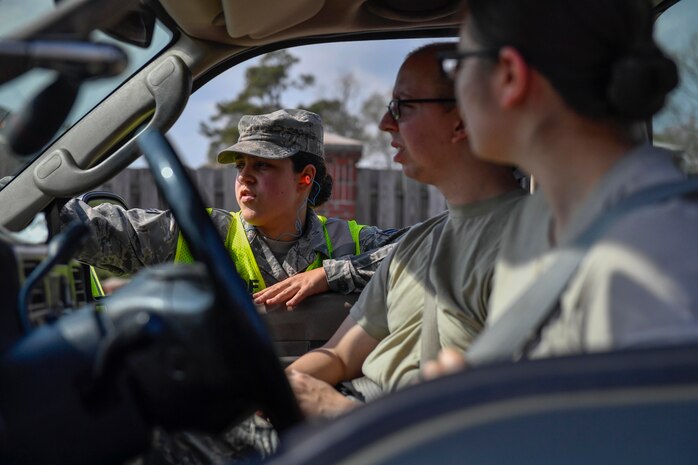 Senior Airman Andressa Dasilva, 437th Aerial port Squadron traffic management specialist, directs the movement of cargo during Exercise Bonny Jack at the Cargo Deployment Facility here, March 1, 2017. Exercise Bonny Jack was a two-day mobility exercise testing the cargo deployment capabilities of the 437th Airlift Wing. Members of Team Charleston conducted 24-hour operations for the exercise to move 95 short tons of cargo.
