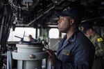 Chief Engineman Paris Pharisien stands conning officer watch aboard the amphibious transport dock ship USS Green Bay (LPD 20) as the ship transits through the South China Sea. Green Bay, with embarked 31st Marine Expeditionary Unit (MEU), transited the South China Sea on a routine patrol, Mar. 2, 2017. Green Bay, with embarked 31st Marine Expeditionary Unit (MEU) is operating in the Indo-Asia-Pacific region to enhance partnerships and be a ready-response force for any type of contingency.