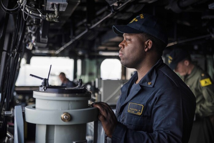 Chief Engineman Paris Pharisien stands conning officer watch aboard the amphibious transport dock ship USS Green Bay (LPD 20) as the ship transits through the South China Sea. Green Bay, with embarked 31st Marine Expeditionary Unit (MEU), transited the South China Sea on a routine patrol, Mar. 2, 2017. Green Bay, with embarked 31st Marine Expeditionary Unit (MEU) is operating in the Indo-Asia-Pacific region to enhance partnerships and be a ready-response force for any type of contingency.