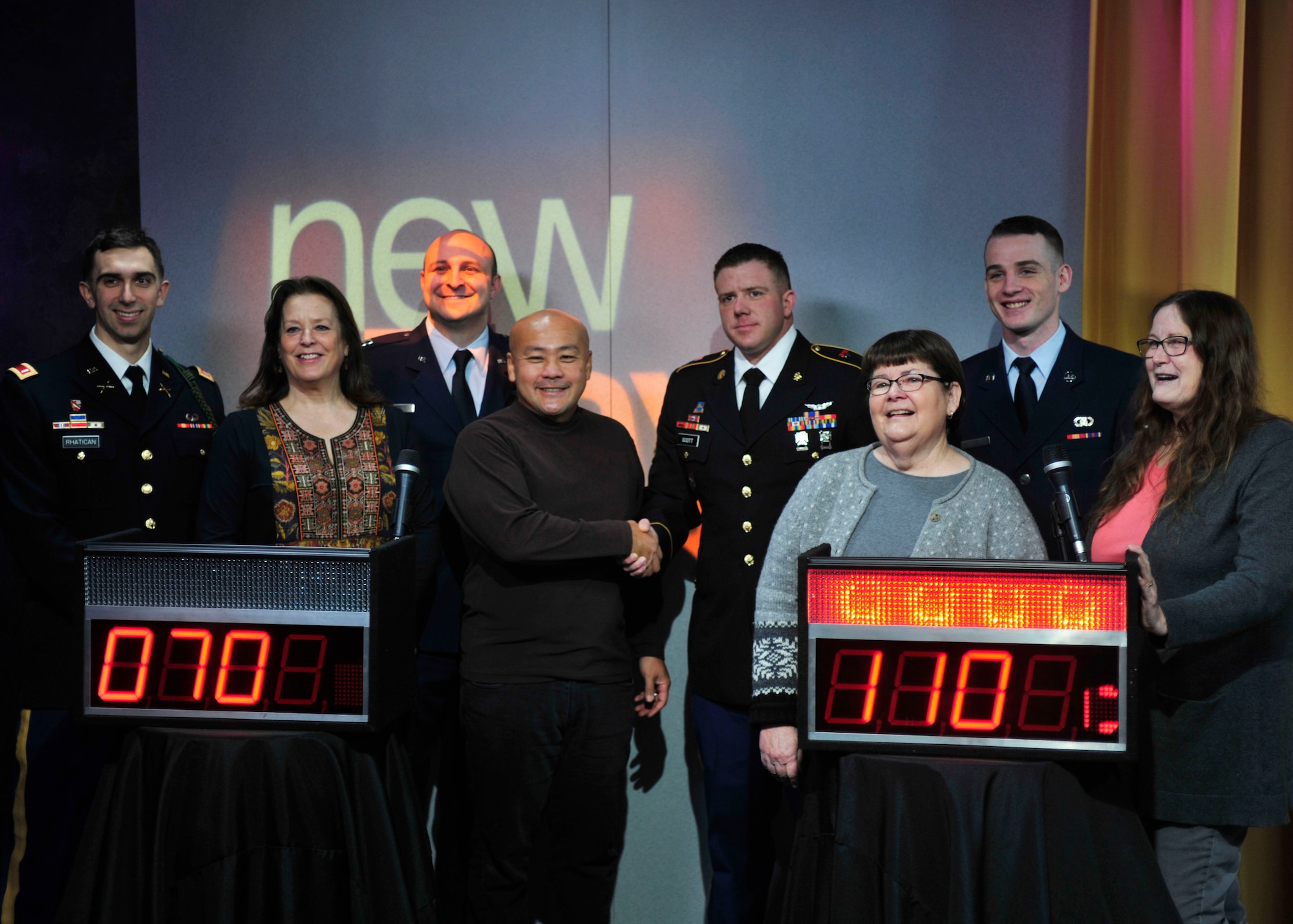 U.S. Soldiers and U.S. Airmen from Joint Base Lewis-McChord, Wash., pose for a photo with a group of civilians from the King 5 “New Day” show studio audience following a game of head-to-head trivia, Feb. 28, 2017 in Seattle, Wash. Though the competition was close, the team representing JBLM, which featured two Soldiers and two Airmen, emerged victorious. (U.S. Air Force photo/Staff Sgt. Whitney Amstutz)