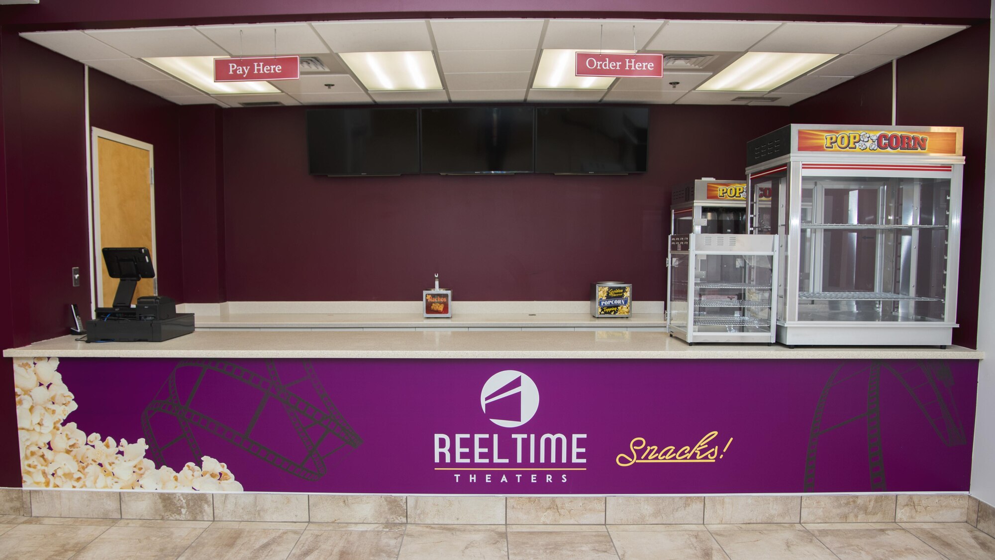 A newly renovated concession stand sits inside the base theater at Joint Base Andrews, Md., March 3, 2017. The theater building was revamped with new seats, sound system, projector, and concession stand, which will be debuted at the theater’s grand opening scheduled for March 4, 2017, at 7 p.m. (U.S. Air Force photo by Airman 1st Class Valentina Lopez)