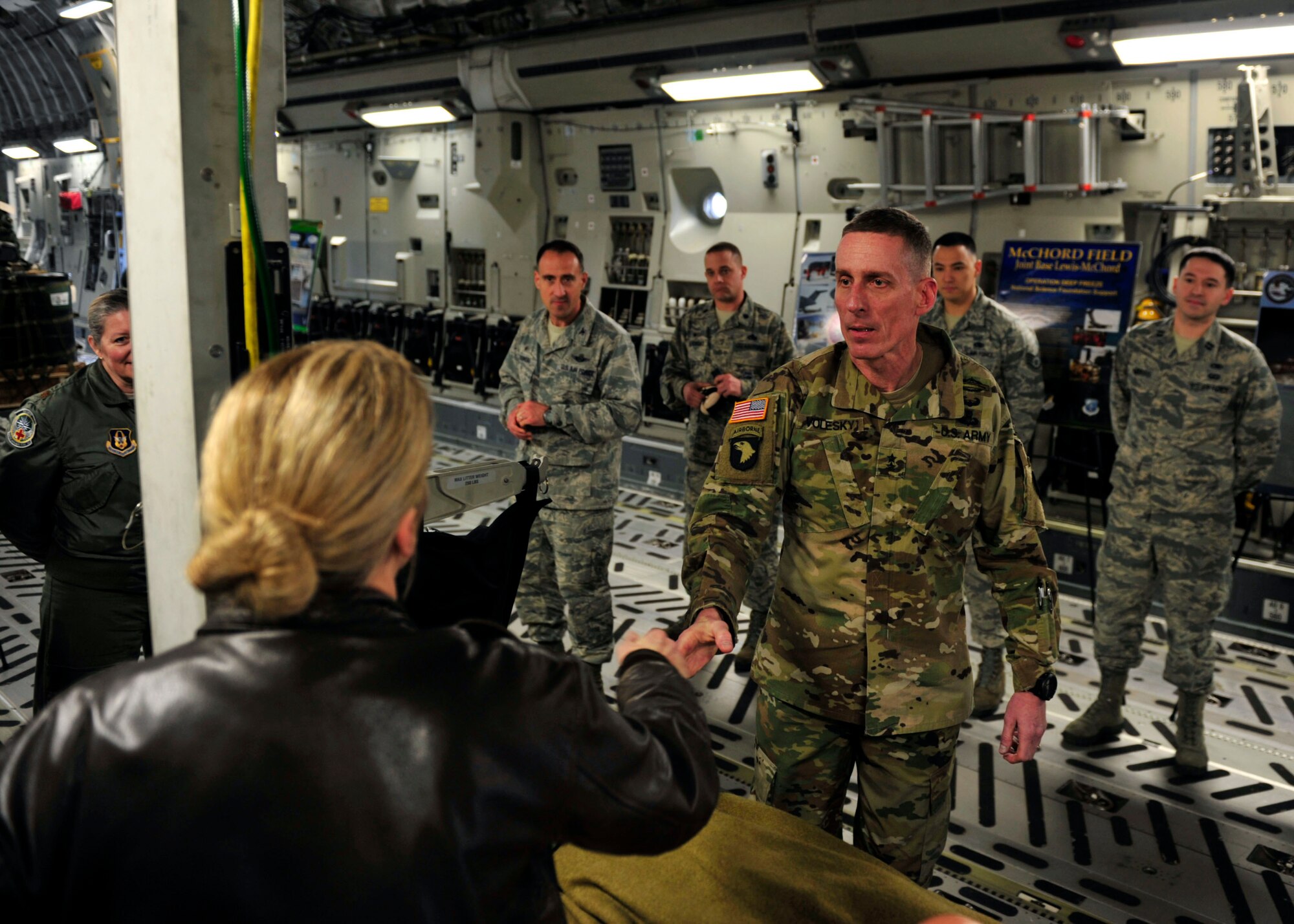 U.S. Army Maj. Gen. Gary Volesky, incoming I Corps commanding general, shakes hands with an Airman prior to receiving an interactive C-17 brief during a tour on the McChord Field flightline, March 2, 2017 at Joint Base Lewis-McChord. The tour was designed to better acquaint Volesky with Air Force capabilities and mission sets prior to his transition as the I Corps commanding general. (U.S. Air Force photo/Staff Sgt. Whitney Amstutz)