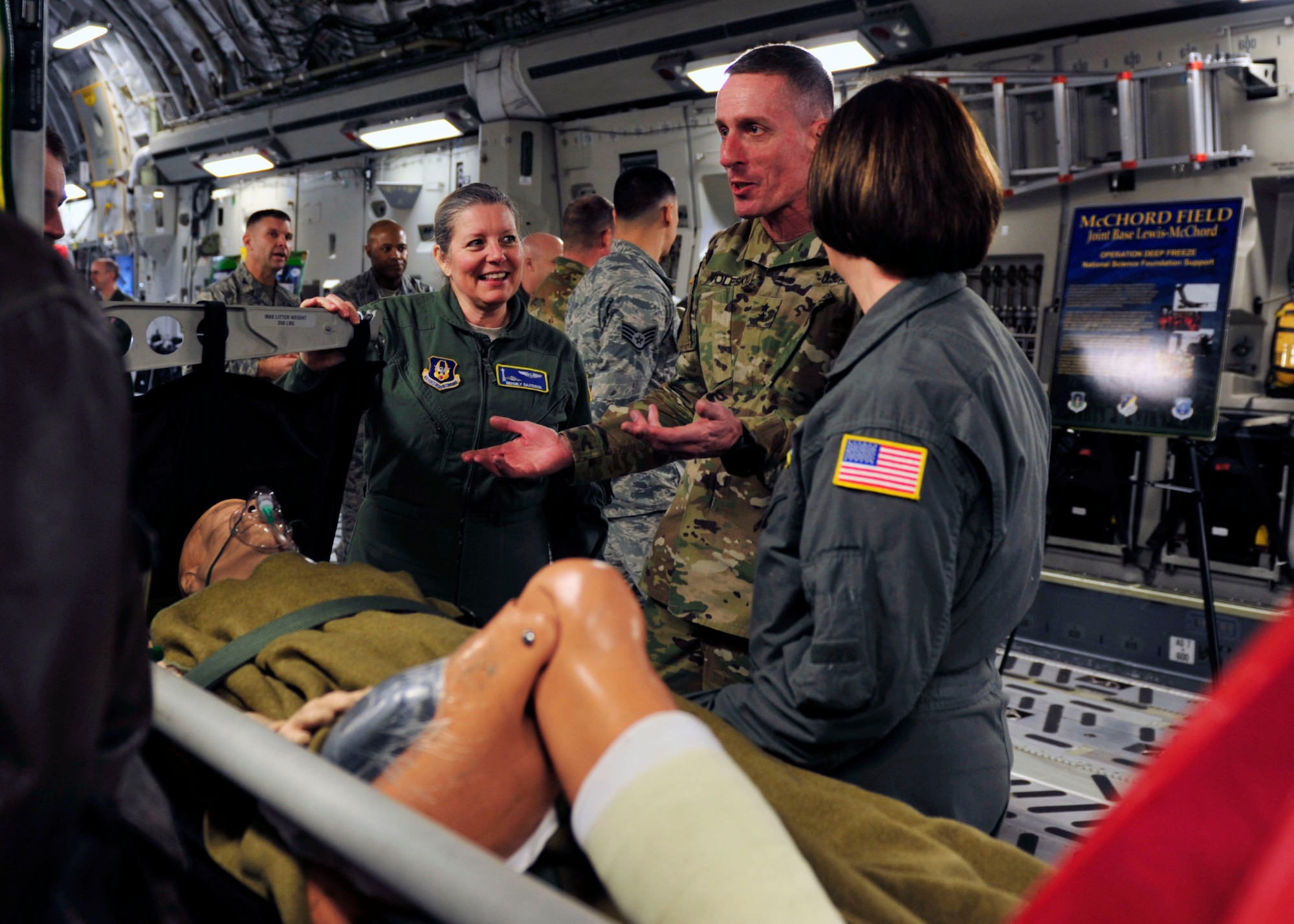 U.S. Army Maj. Gen. Gary Volesky (center), incoming I Corps commanding general, discusses the Aeromedical Evacuation mission with 446th Aeromedical Evacuation Squadron members, Chief Master Sgt. Saudi McVea and Maj. Beverly Davidson, during a tour, March 2, 2017 at Joint Base Lewis-McChord. The tour also featured briefings on the Joint Precision Airdrop System, Prime Nuclear Airlift Force, and Operation Deep Freeze. (U.S. Air Force photo/Staff Sgt. Whitney Amstutz)