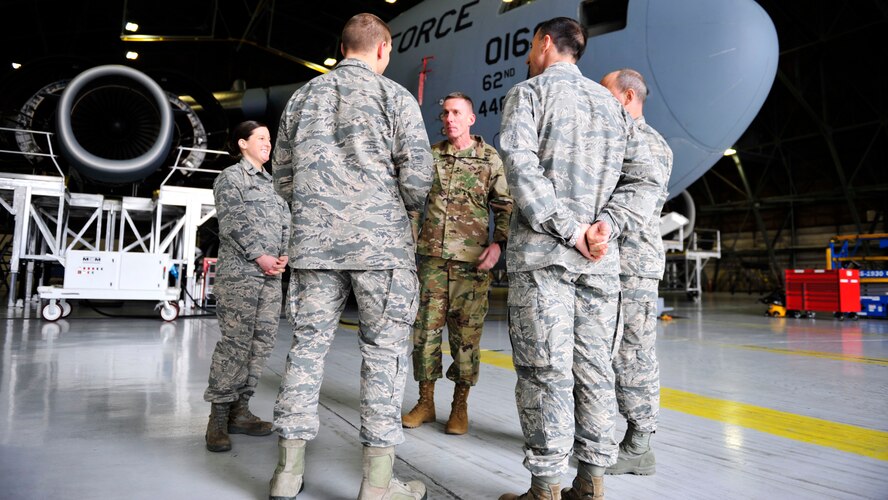 U.S. Army Maj. Gen. Gary Volesky (center), listens during a 62nd Maintenance Squadron operations brief on the McChord Field flightline, March 2, 2017 at Joint Base Lewis-McChord. The tour also featured briefings on the Joint Precision Airdrop System, Prime Nuclear Airlift Force, Operation Deep Freeze and the 446th Airlift Wing Aeromedical Evacuation mission. (U.S. Air Force photo/Staff Sgt. Whitney Amstutz)