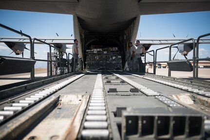 Participants of the 612th Air Base Squadron's "Crew Chief for a Day" program watch how cargo is loaded into a C-130 Hercules aircraft at Soto Cano Air Base, March 2. The program aims to get other servicemembers from JTF-Bravo to come out to the airfield and experience a day in the life of a U.S. Air Force crew chief.