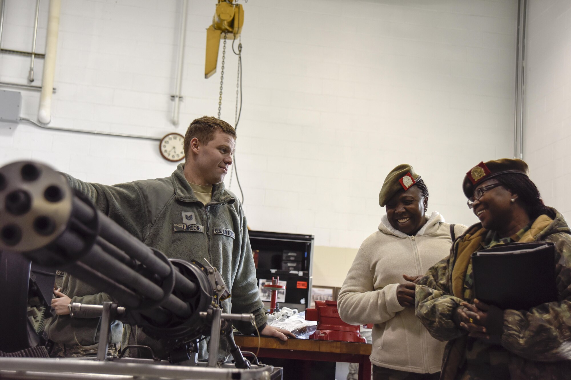 Tech. Sgt. Mike Larson, 114th Aircraft Maintenance weapons specialists, discusses the weapon system of the F-16 with Maj. Sieglein Grot, Suriname Army, Head of Suriname Military Family Support, and Capt. Hemma Grebbe, Suriname Army, Head of S1, during the Suriname officer visit March 3, 2017 at Joe Foss Field, S.D. Female Officers of the Suriname Army visited with members of the South Dakota Air National Guard as part of a Women in Leadership Subject Matter Exchange program. (U.S. Air National Guard photo by Staff Sgt. Duane Duimstra/Released)