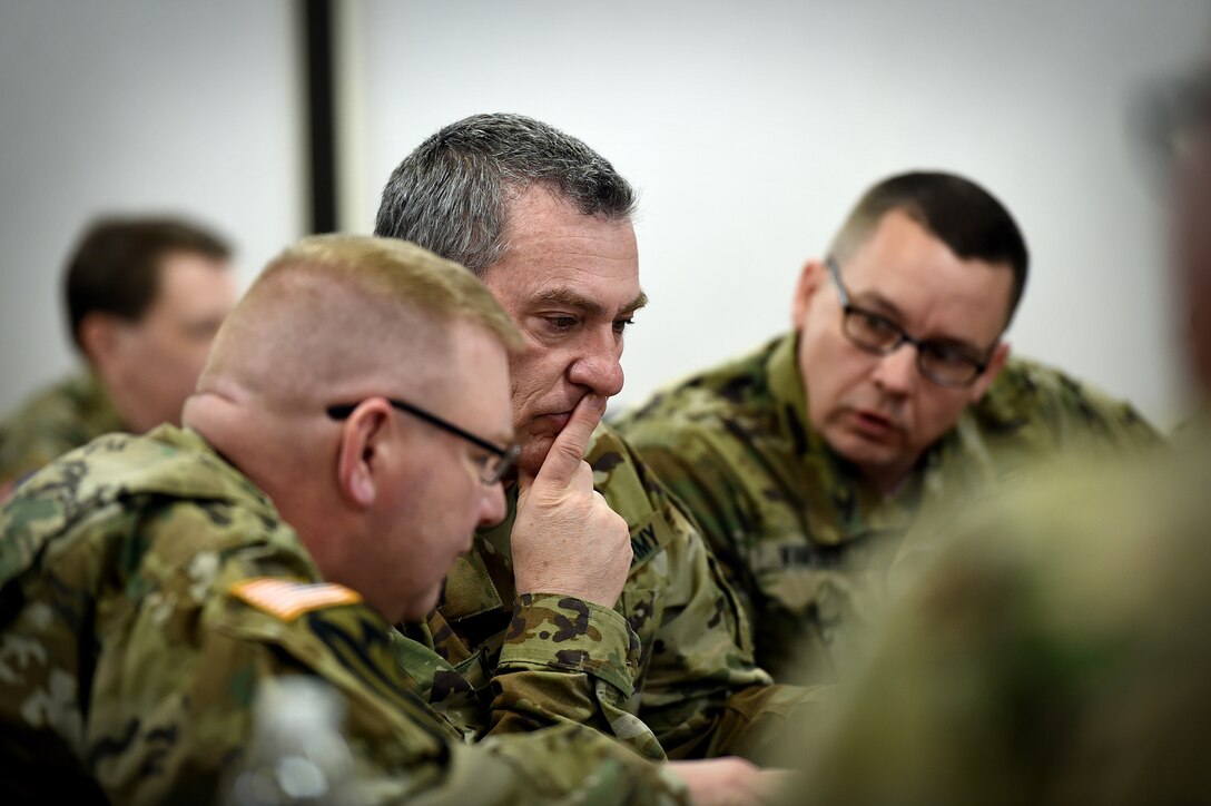 Briefing participants converse ahead of an operational mobilization training and assessment brief hosted by the 85th Support Command, at their headquarters outside of Chicago, Mar. 3, 2017.  The briefing was to prepare the 85th Support Command’s Army Reserve logistics support and training support battalions, operationally controlled by First Army, that have been identified for upcoming mobilizations in support of First Army’s post mobilization training requirements at Mobilization Force Generation Installations. Throughout the three-day assessment brief, the command staffs prepare the units in terms of readiness, training, equipment and personnel. The briefing highlights the Army Reserve’s contribution within the multi-component partnership shared with First Army. Army Reserve Soldiers have different mechanisms, and funding allocations to name a few contrasts from their active component partners, but Col. Robert Cooley, Deputy Commander, 85th Support Command, explained that the end state is the same – to get trained Soldiers ready to do their mission whether it is CONUS (Continental United States) or OCONUS (Outside Continental United States). The goal for the three-day event is to establish a unified, synchronized deployment readiness plan for the execution of pre-deployment training.
(U.S. Army photo by Master Sgt. Anthony L. Taylor/Released)
