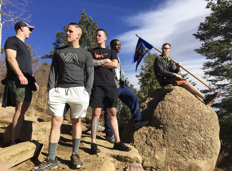 50th Security Forces Squadron defenders wait for their fellow defenders at the top of the Incline at Manitou Springs, Colorado, Friday, March 3, 2017. The squadron held the hiking event to honor Senior Airman Nicholas Alden, a fallen defender from 48th Security Forces Squadron at RAF Lakenheath. He was shot and killed in March 2011 on a bus at Frankfurt International Air Terminal in Germany, while enroute to Afghanistan. (U.S. Air Force photo/Tech. Sgt. Julius Delos Reyes)