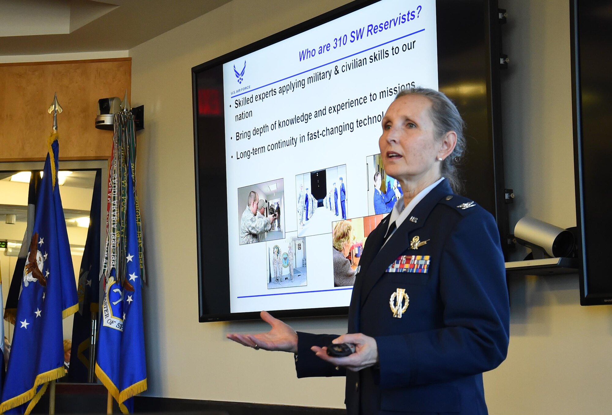 Col. Traci Kueker-Murphy, 310th Space Wing commander, briefs State of the Base attendees about the 310th Space Wing Reserve unit.  Kueker-Murphy spoke about the relationship reservists have with the community and other key issues. (U.S. Air Force photo/Tech. Sgt. Sara Bishop)