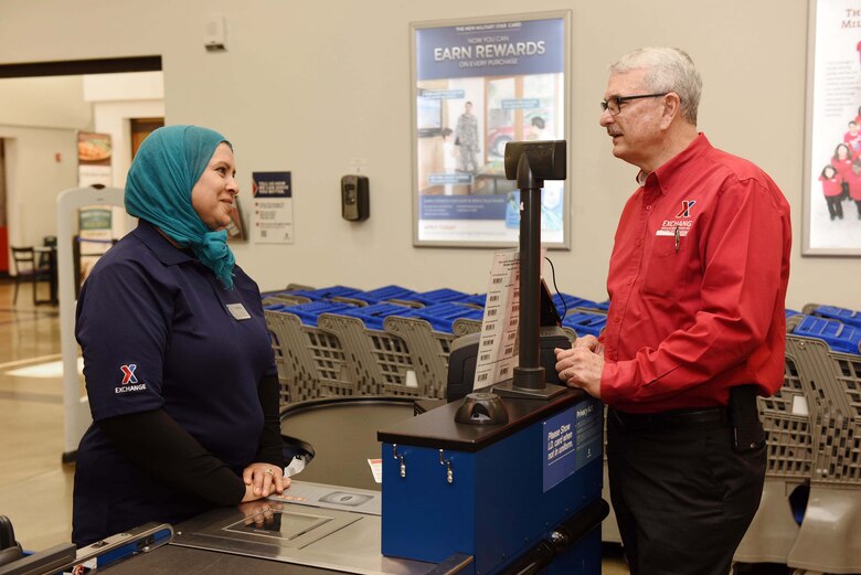 Mike Immler, Army and Air Force Exchange Service deputy director, speaks with Fatiha Armstrong, Exchange store associate, during a tour of AAFES facilities, March 1, 2017, Vandenberg Air Force Base, Calif. Immler toured the AAFES facilities to ensure needs of Airmen are met. (U.S. Air Force photo by Tech. Sgt. Jim Araos/Released)