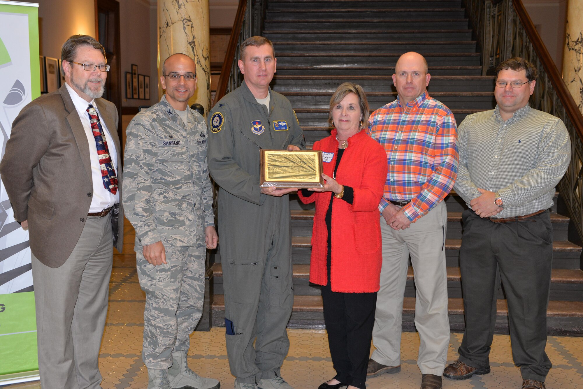 Michael Jago, 14th Civil Engineer Squadron Environmental Chief; Col. Anthony Sansano, 14th Flying Training Wing Mission Support Group Commander; Col. James Fisher, 14th FTW Vice Commander; Sarah Kountouris, President of the Mississippi Recycling Coalition and Keep Mississippi Beautiful Executive Director; Mike Blythe, 14th CES Qualified Recycling Program Manager and Installation Biological Scientist; and Allen Reed, 14th CES Installation Management Flight Chief, accept the Environmental Hero Award Mar. 2, 2017, at the Mississippi State House in Jackson.