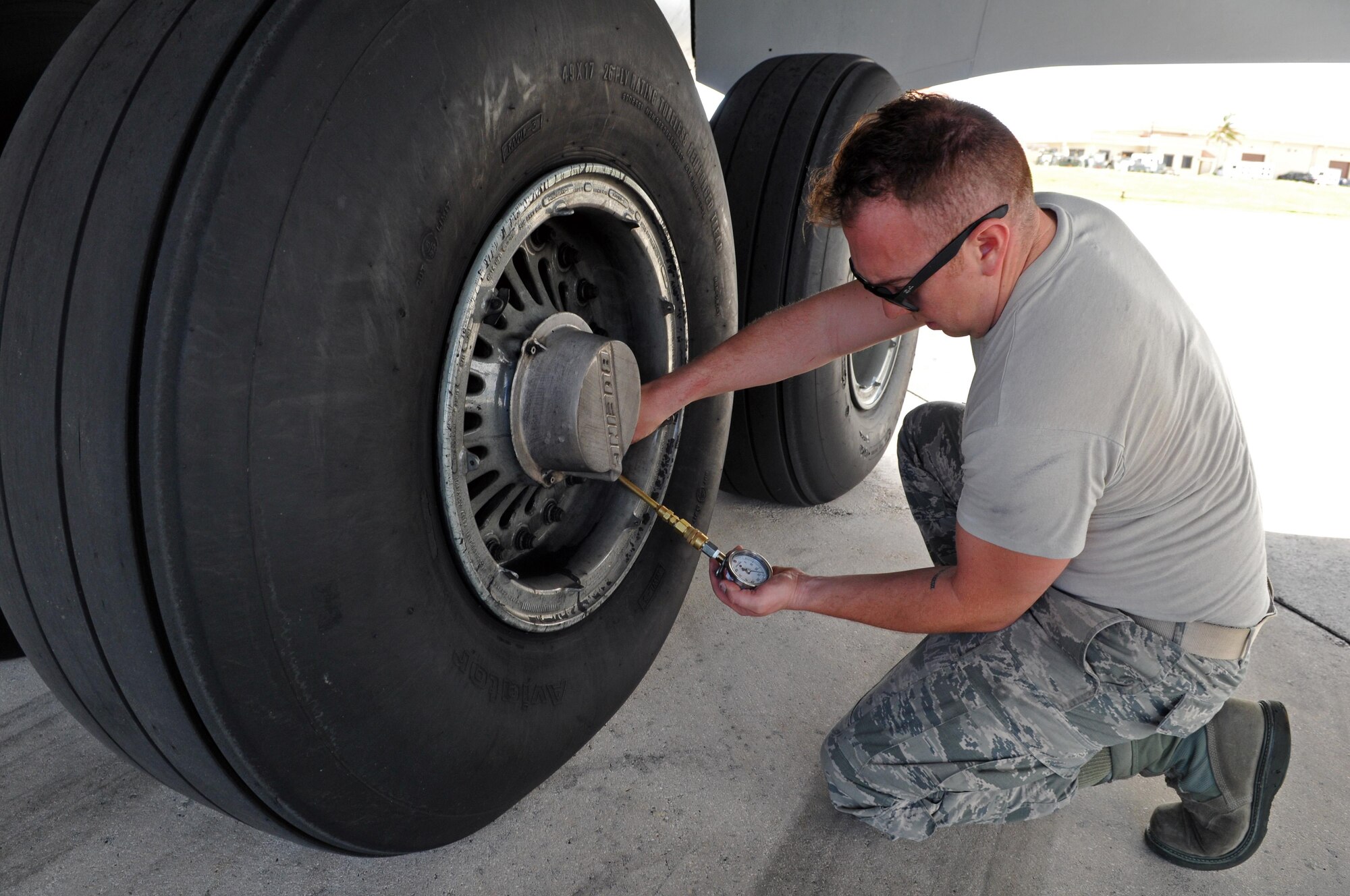 Master Sgt. George LaCome, a crew chief with the 151st Maintenance Group checks the tire pressure on a KC-135R Stratotanker during a preflight inspection in Andersen Air Force Base, Guam. The Utah Air Guard aircraft and six-person crew conducted an aeromedical evacuation mission in the Pacific theater Feb. 8-25, 2017.