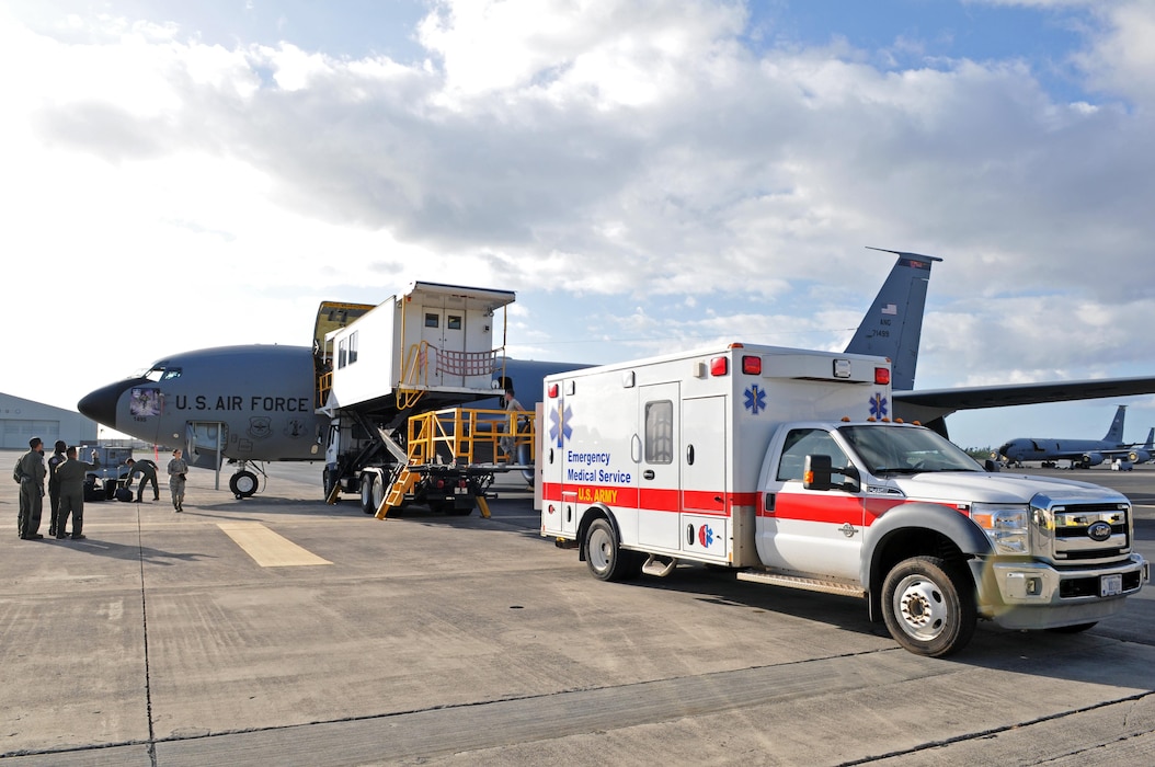 Medical personnel prepare to transfer patients from a KC-135R Stratotanker to an ambulance after arriving on an aeromedical evacuation flight to Hickam Air Force Base, Hawaii on Feb. 23, 2017. (U.S. Air National Guard photo by Tech. Sgt. Annie Edwards)