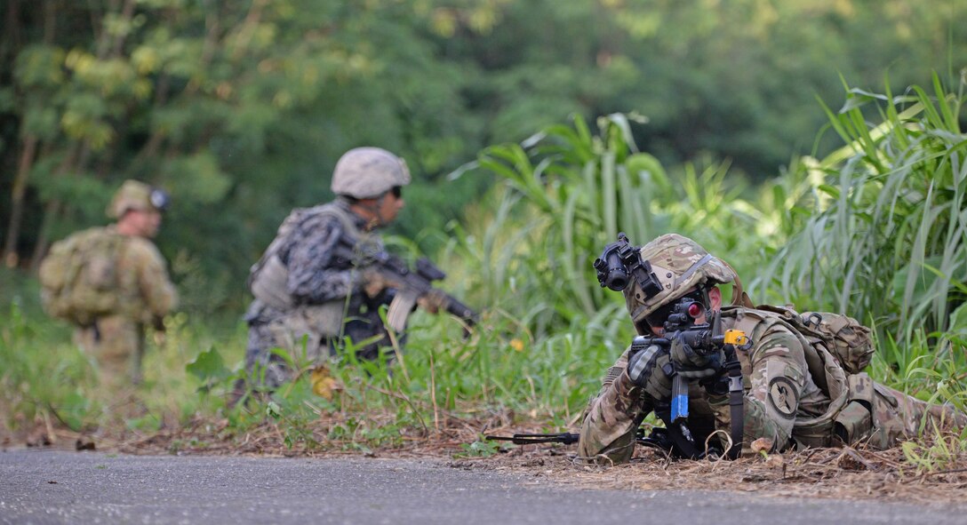 Royal Australian Air Force, left, Japan Air Self-Defense Force, center, and U.S. Air Force, right, security for airmen secure an area during Exercise Cope North 17 at North Field, Tinian, Feb. 22, 2017. The exercise includes 31 units and more than 2,700 personnel from three countries and continues the growth of strong, interoperable relationships within the Indo-Asia-Pacific region through integration of airborne and land-based command and control (U.S. Air Force photo by Airman 1st Class Jacob Skovo)
