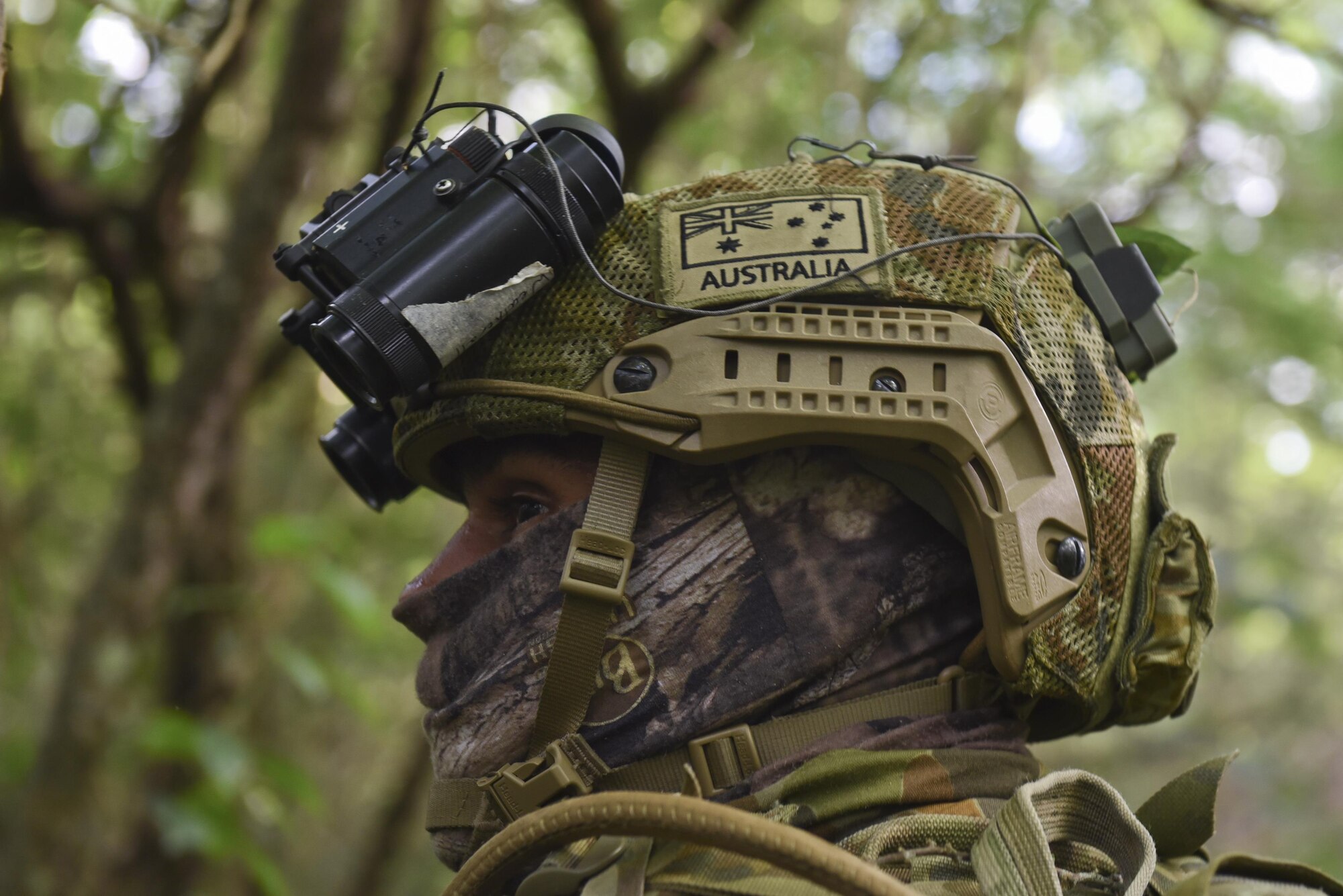 Royal Australian Air Force Leading Air Craftsman  Kyle Weatherall, No. 1 Security Forces section gunner, searches for simulated opposing forces during Exercise Cope North 17 at North Field, Tinian, Feb. 22, 2017. The exercise includes 31 units and more than 2,700 personnel from three countries and continues the growth of strong, interoperable relationships within the Indo-Asia-Pacific region through integration of airborne and land-based command and control (U.S. Air Force photo by Airman 1st Class Jacob Skovo)