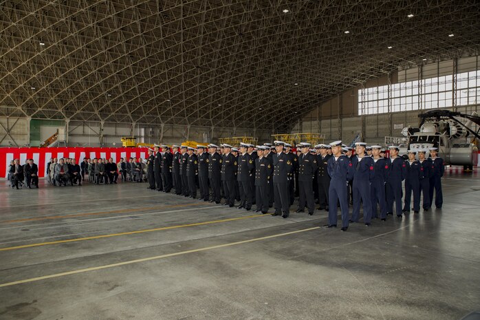 Japan Maritime Self-Defense Force personnel with Mine Countermeasures Helicopter Squadron 111 (HM-111) stand at parade rest before the start of a retirement ceremony to decommission the last two remaining active MH-53E helicopters from service at Marine Corps Air Station Iwakuni, Japan, March 3, 2017. The MH-53E’s flew 6,000 hours throughout 27 years as airborne mine countermeasures and heavy transport helicopters for HM-111. (U.S. Marine Corps photo by Lance Cpl. Joseph Abrego)