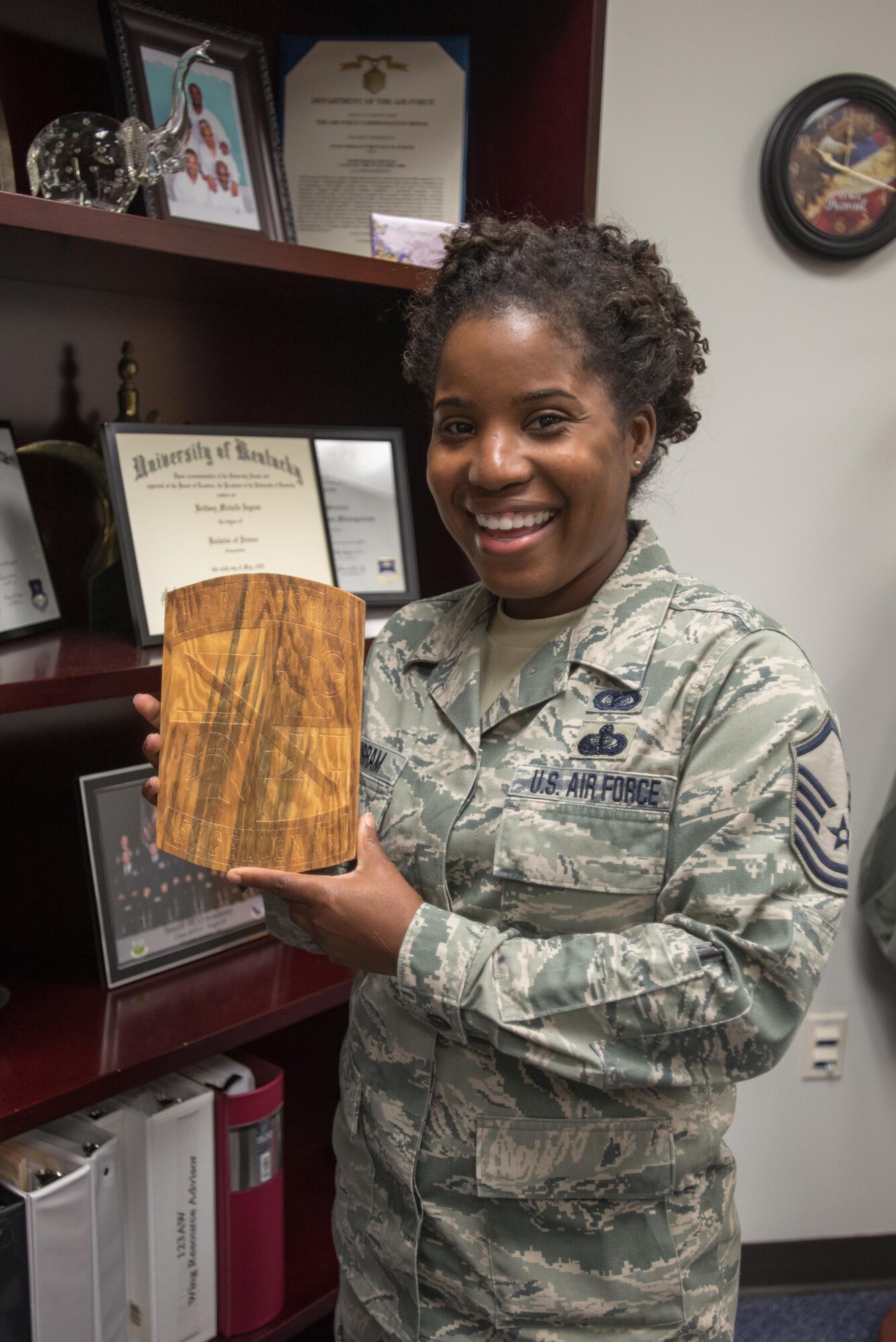Master Sgt. Brittany Ingram, an Airman from the 123rd Airlift Wing Louisville, Kentucky, shows the plaque given to her by the group of U.S. Army Reserve Officer Corps cadets that she accompanied to Djibouti, Africa over the summer as a cadre member for the U.S. Army Command’s Cultural Language and Proficiency program. (U.S. Air National Guard photo by Tech. Sgt. Vicky Spesard)