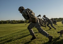 Staff Sgt. Chris Kizanis, of Boise State, Idaho, U.S. Army Reserve International Combat Team competitor, rushes to the next berm 100 meters away during a Rifle International Match to engage targets in various firing positions during the 2015 Canadian Armed Forces Small Arms Concentration at the Connaught Range outside of Ottawa, Canada, Sept. 15. The marksmanship competition brought in more than 250 total competitors from the British, Canadian and U.S. armed forces competing in more than 50 matches involving rifle, pistol and light machine gun events using various combat-like movements and scenarios. (U.S. Army photo by Master Sgt. Michel Sauret)
