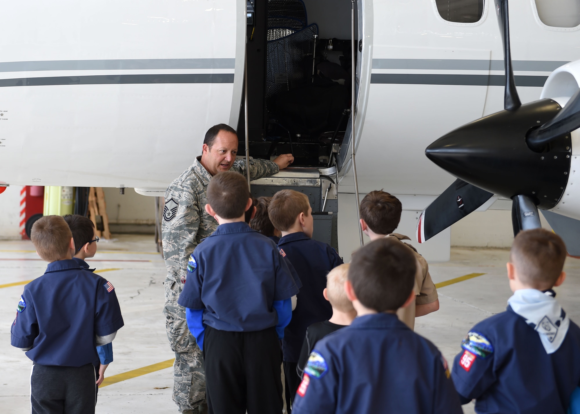 Master Sgt. Dave Bingam shows off the RC-26 aircraft to Cub Scouts, March 4, 2017 at the Des Moines Airbase, Iowa. Scouts from Iowa Pack 95 toured the base, learned about the Wing's missions and recieved safety demonstrations. (U.S. Air National Guard photo by Staff Sgt. Michael J. Kelly)