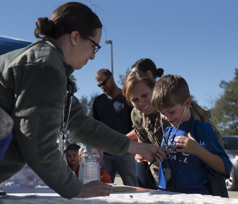 A new 919th Special Operations Wing deployer gives himself a check-up prior to their mission during the Operation Hero event at Duke Field, Fla., March 4.  The wing held a mock deployment for the Reserve children to include a deployment line, simulated flight and a “down range” location with games and displays.  (U.S. Air Force photo/Samuel King Jr.)