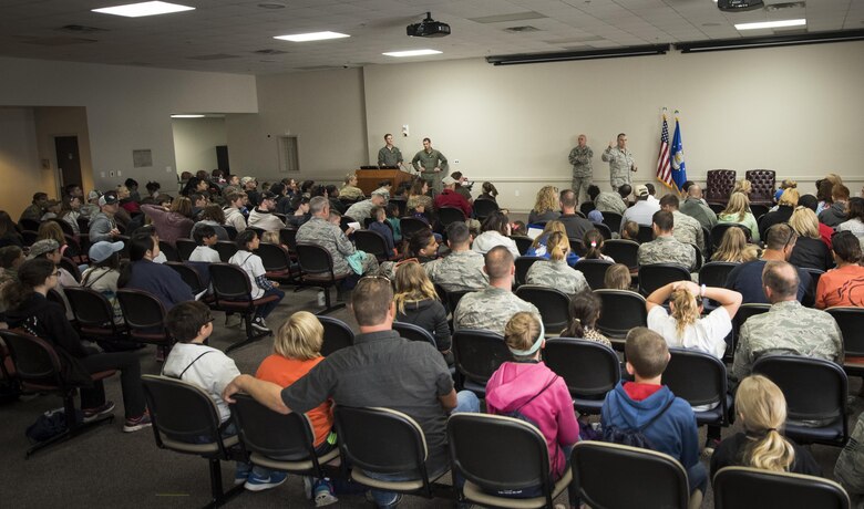 The 919th Special Operations Wing commander, Col. James Phillips, briefs his new troops prior to their deployment during the Operation Hero event at Duke Field, Fla., March 4.  The wing held a mock deployment for the Reserve children to include a deployment line, simulated flight and a “down range” location with games and displays.  (U.S. Air Force photo/Samuel King Jr.)
