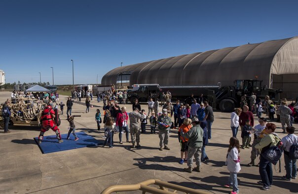 The side of the MADD building became a busy deployed location as part of the 919th Special Operations Wing’s Operation Hero event at Duke Field, Fla., March 4.  The wing held a mock deployment for the Reserve children to include a deployment line, simulated flight and a “down range” location with games and displays.  (U.S. Air Force photo/Samuel King Jr.)