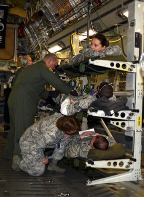 Air Force and Army medics stabilize patients aboard a C-17 Globemaster III for transport from Patrick Air Force Base, Florida, March 4, 2017 as part of the fifth annual MEDBEACH joint medical response exercise. The exercise prepares service members for deployment by offering realistic medical scenarios. (U.S. Air Force photo/Tech. Sgt. Lindsey Maurice)