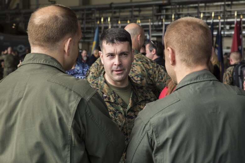 U.S. Marine Corps Lt. Col. Richard M. Rusnok Jr., Marine Fighter Attack Squadron (VMFA) 121’s new commanding officer, speaks with U.S. Navy Sailors after a change of command ceremony at Marine Corps Air Station Iwakuni, Japan, March 3, 2017. U.S. Marine Corps Lt. Col. J.T. Bardo relinquished his duties as VMFA-121 commanding officer to Rusnok after serving as the squadron commander since August 2015. (U.S. Marine Corps photo by Cpl. Aaron Henson)