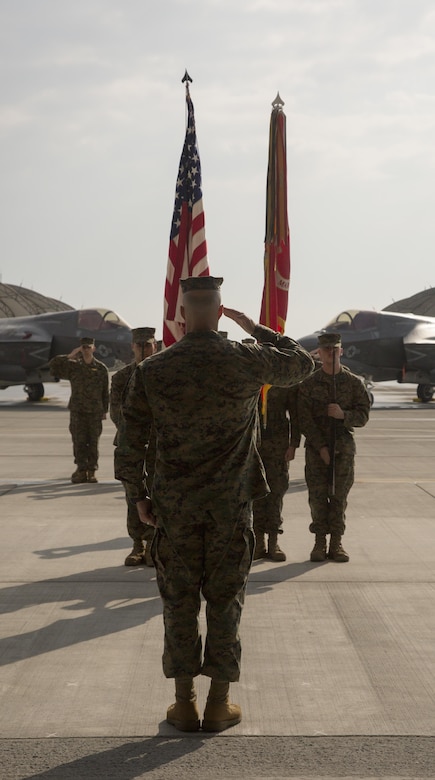 Marines, Sailors and civilian personnel gather on Marine Corps Air Station Iwakuni, Japan, to observe a change of command ceremony for Marine Fighter Attack Squadron (VMFA) 121, March 3, 2017.  Lt. Col. J.T. Bardo, outgoing commanding officer of VMFA-121, led the squadron during their move from Marine Corps Air Station Mirimar, California to MCAS Iwakuni and transferred the command to Lt. Col. Richard M. Rusnok Jr. (U.S. Marine Corps photo by Lance Cpl. Jacob A. Farbo)