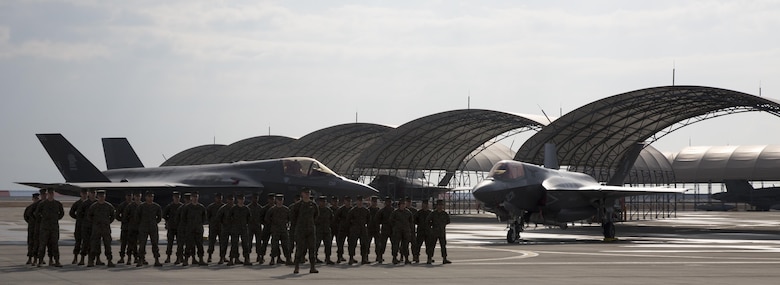 Marines, Sailors and civilian personnel gather on Marine Corps Air Station Iwakuni, Japan, to observe a change of command ceremony for Marine Fighter Attack Squadron (VMFA) 121, March 3, 2017.  Lt. Col. J.T. Bardo, outgoing commanding officer of VMFA-121, led the squadron during their move from Marine Corps Air Station Mirimar, California to MCAS Iwakuni and transferred the command to Lt. Col. Richard M. Rusnok Jr. (U.S. Marine Corps photo by Lance Cpl. Jacob A. Farbo)