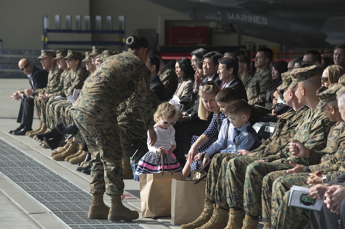 Marines, Sailors and civilian personnel gather on Marine Corps Air Station Iwakuni, Japan, to observe a change of command ceremony for Marine Fighter Attack Squadron (VMFA) 121, March 3, 2017.  Lt. Col. J.T. Bardo, outgoing commanding officer of VMFA-121, led the squadron during their move from Marine Corps Air Station Mirimar, California to MCAS Iwakuni and transferred the command to Lt. Col. Richard M. Rusnok Jr. (U.S. Marine Corps photo by Lance Cpl. Jacob A. Farbo)