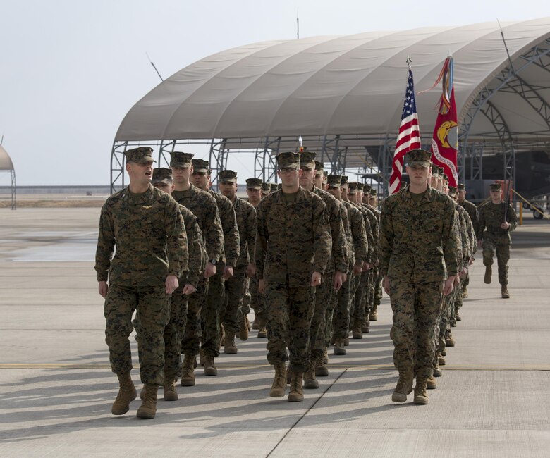 Marines, Sailors and civilian personnel gather on Marine Corps Air Station Iwakuni, Japan, to observe a change of command ceremony for Marine Fighter Attack Squadron (VMFA) 121, March 3, 2017.  Lt. Col. J.T. Bardo, outgoing commanding officer of VMFA-121, led the squadron during their move from Marine Corps Air Station Mirimar, California to MCAS Iwakuni and transferred the command to Lt. Col. Richard M. Rusnok Jr. (U.S. Marine Corps photo by Lance Cpl. Jacob A. Farbo)