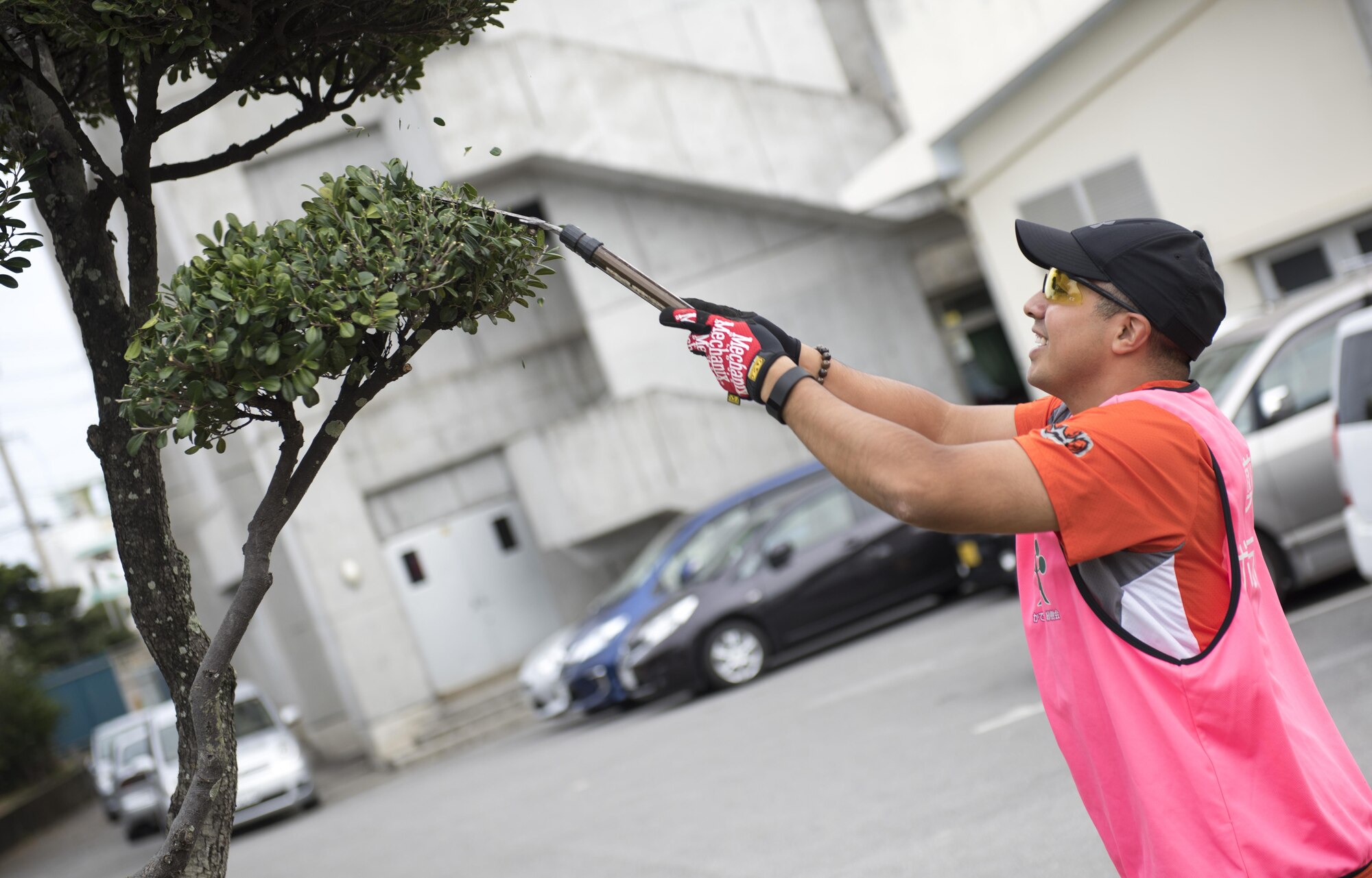 U.S. Air Force Tech. Sgt. James Rivas, 909th Aircraft Maintenance Unit specialist section chief, landscapes the leaves of a tree branch at Yara Elementary School for a volunteer event, March 5, 2017, at Kadena Town, Japan. Airmen from the 909th AMU volunteer almost every third Sunday of the month with the Kadena Ryoku Ju Kai to landscape Kadena Town. The group landscapes schools, police stations, and street roads in Kadena Town. (U.S. Air Force photo by Senior Airman Omari Bernard/Released)