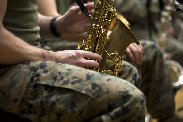 Staff Sgt. Michael Newell, a saxophone instrumentalist with III Marine Expeditionary Force Band, rehearses alongside his fellow Marines at the III MEF Band Hall aboard Camp Foster, Okinawa, Japan, March 1, 2017. At age 12, Newell began practicing the saxophone. Newell was recognized for his musical talents, Marine Corps accomplishments and nominated for Marine Corps Staff Noncommissioned Officer Musician of the Year. (U.S. Marine Corps photo by Lance Cpl. Andy Martinez) 