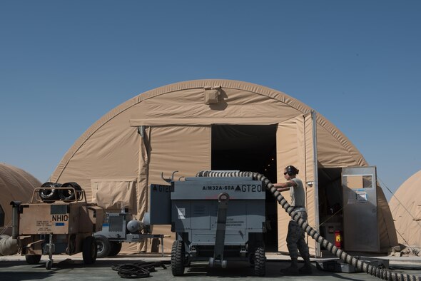 Senior Airman Melissa Jones, 332nd Expeditionary Maintenance Group  aerospace ground equipment journeyman, monitors gauges on an A/M32A-60A generator, commonly referred to as a Dash 60, during an inspection at the 407th Air Expeditionary Group, Feb. 27, 2017. The AGE Airmen maintain the ground equipment needed to service transient aircraft.  (U.S. Air Force photo/Master Sgt. Benjamin Wilson)(Released)