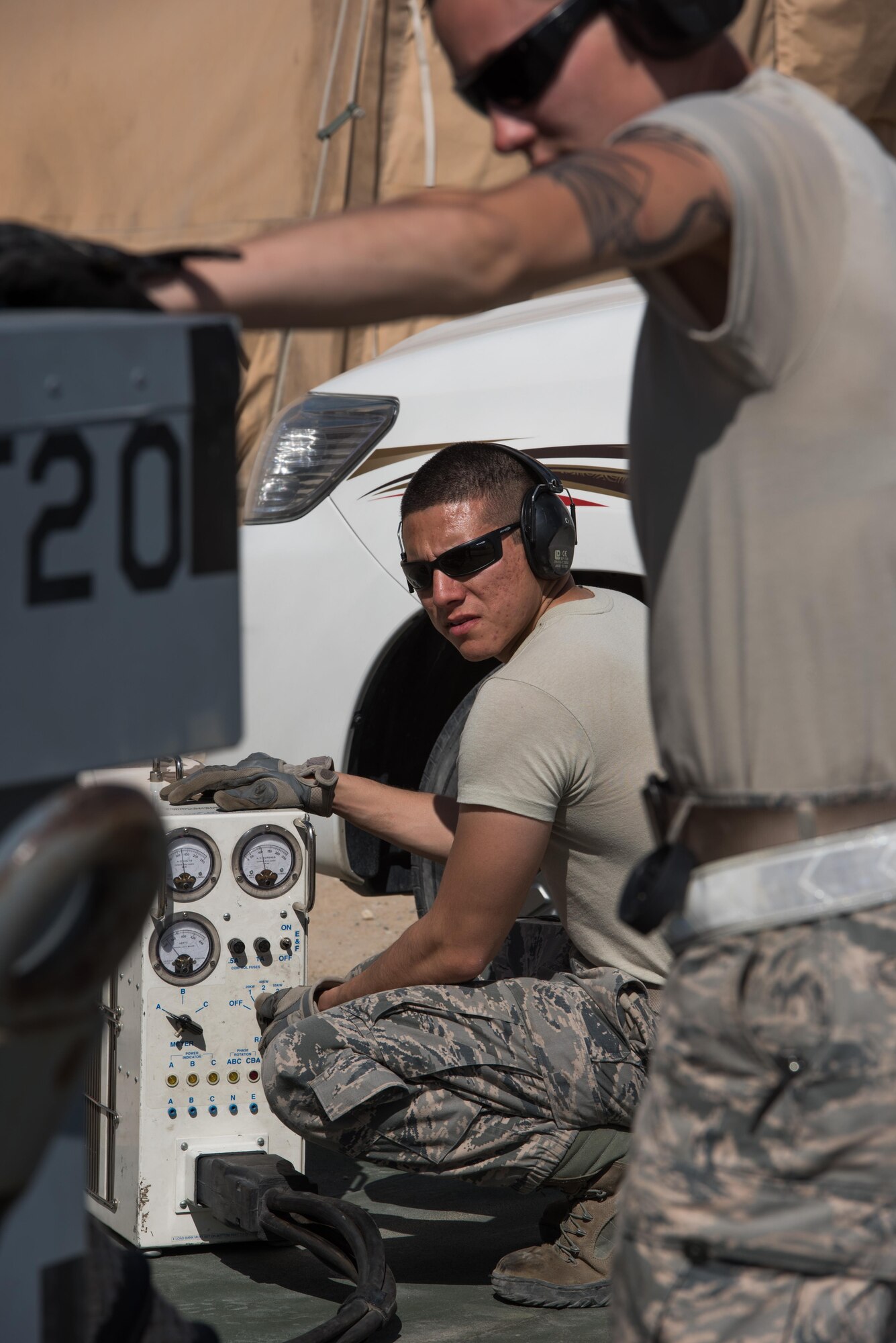 Staff Sgt. Adan Nunez and Senior Airman Melissa Jones, both 332nd Expeditionary Maintenance Group aerospace ground equipment specialists, inspect an A/M32A-60A generator, commonly referred to as a Dash 60, at the 407th Air Expeditionary Group, Feb. 27, 2017. The Dash 60s must be inspected every six months to ensure they are operating correctly. (U.S. Air Force photo/Master Sgt. Benjamin Wilson)(Released)