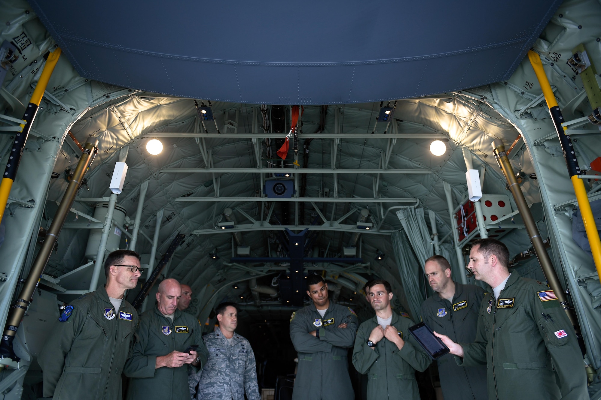 Members of the C-130J delivery team perform a preflight briefing at Kadena Air Base, Japan, March 6, 2017. This is the first C-130J to be assigned to Pacific Air Forces. Yokota serves as the primary Western Pacific airlift hub for U.S. Air Force peacetime and contingency operations. Missions include tactical air land, airdrop, aeromedical evacuation, special operations and distinguished visitor airlift. (U.S. Air Force photo by Staff Sgt. Michael Smith)