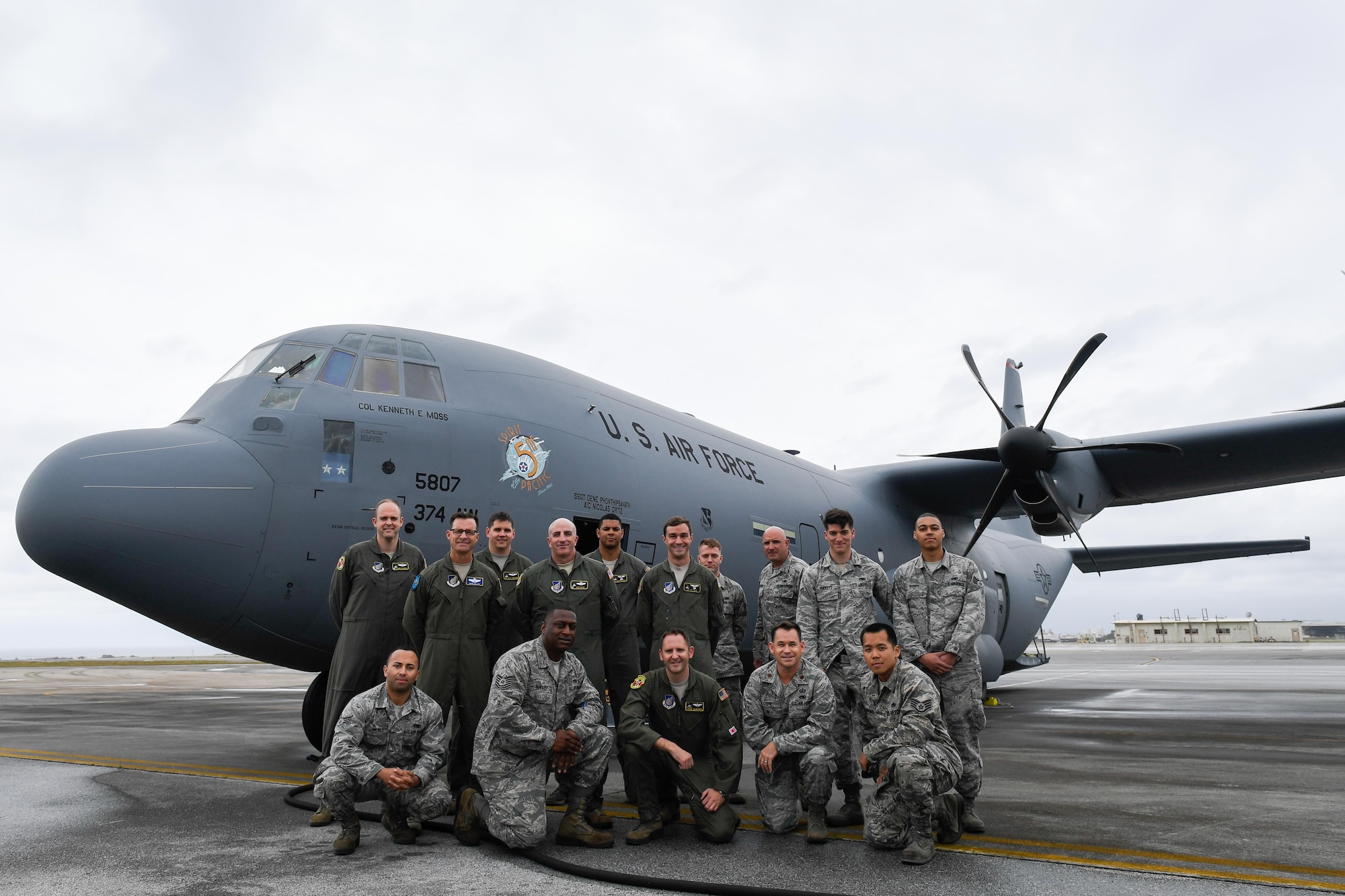 Members of the C-130J delivery team pose for a photo in front of a C-130J Super Hercules at Kadena Air Base, Japan, March 6, 2017. This is the first C-130J to be assigned to Pacific Air Forces.  Yokota serves as the primary Western Pacific airlift hub for U.S. Air Force peacetime and contingency operations. Missions include tactical air land, airdrop, aeromedical evacuation, special operations and distinguished visitor airlift. (U.S. Air Force photo by Staff Sgt. Michael Smith)