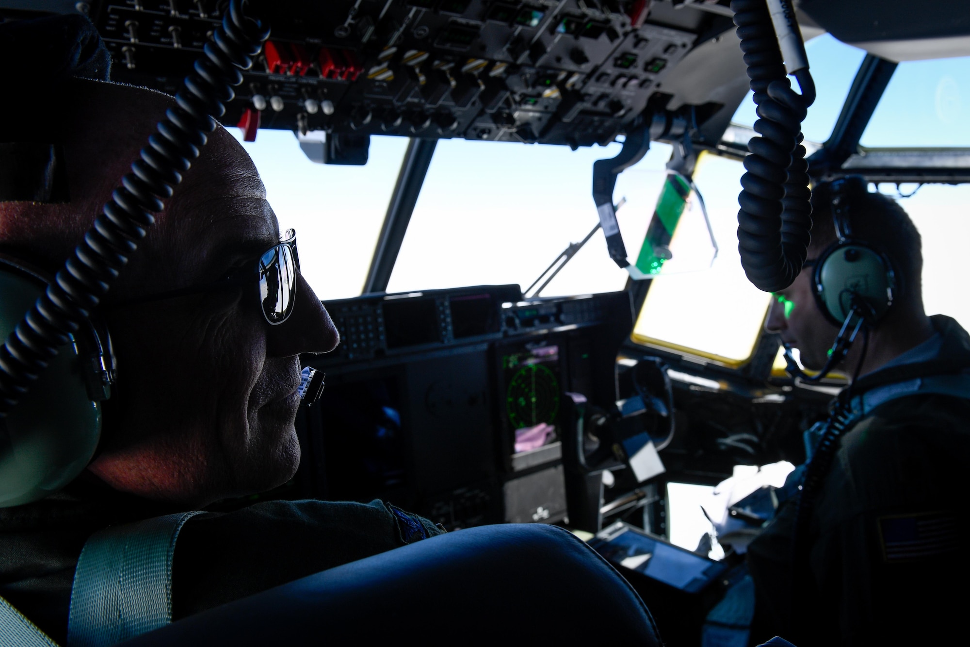 Col. Kenneth Moss, 374th Airlift Wing commander, communicates with his crew members over the Pacific Ocean, March 6, 2017. This is the first C-130J to be assigned to Pacific Air Forces. Yokota serves as the primary Western Pacific airlift hub for U.S. Air Force peacetime and contingency operations. Missions include tactical air land, airdrop, aeromedical evacuation, special operations and distinguished visitor airlift. (U.S. Air Force photo by Staff Sgt. Michael Smith)