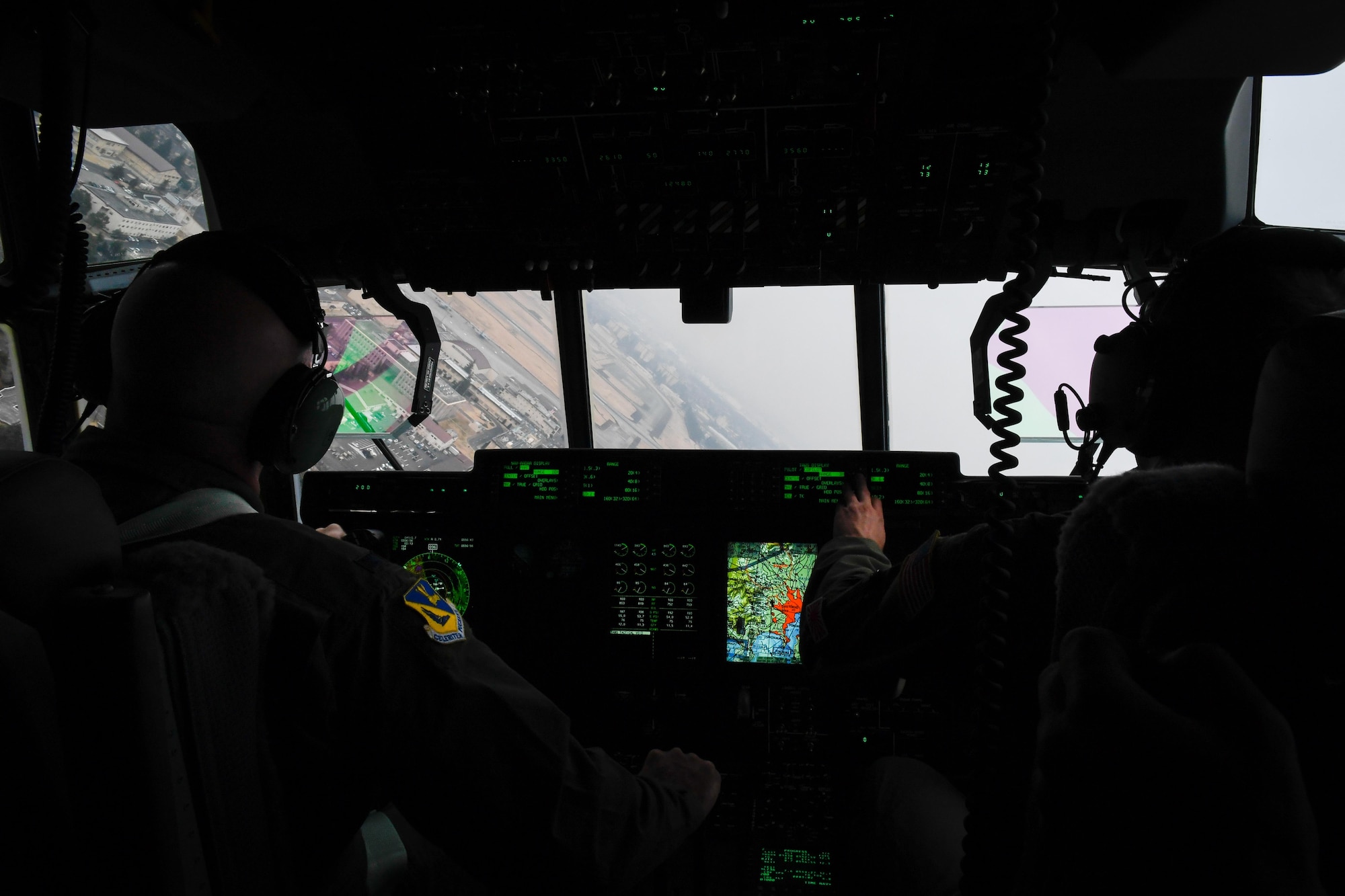 Col. Kenneth Moss, 374th Airlift Wing commander, and Maj. Jesse Klaetsch, 36th Airlift Squadron C-130J pilot, approach for a landing at Yokota Air Base, Japan, March 6, 2017. This is the first C-130J to be assigned to Pacific Air Forces.  Yokota serves as the primary Western Pacific airlift hub for U.S. Air Force peacetime and contingency operations. Missions include tactical air land, airdrop, aeromedical evacuation, special operations and distinguished visitor airlift. (U.S. Air Force photo by Staff Sgt. Michael Smith)