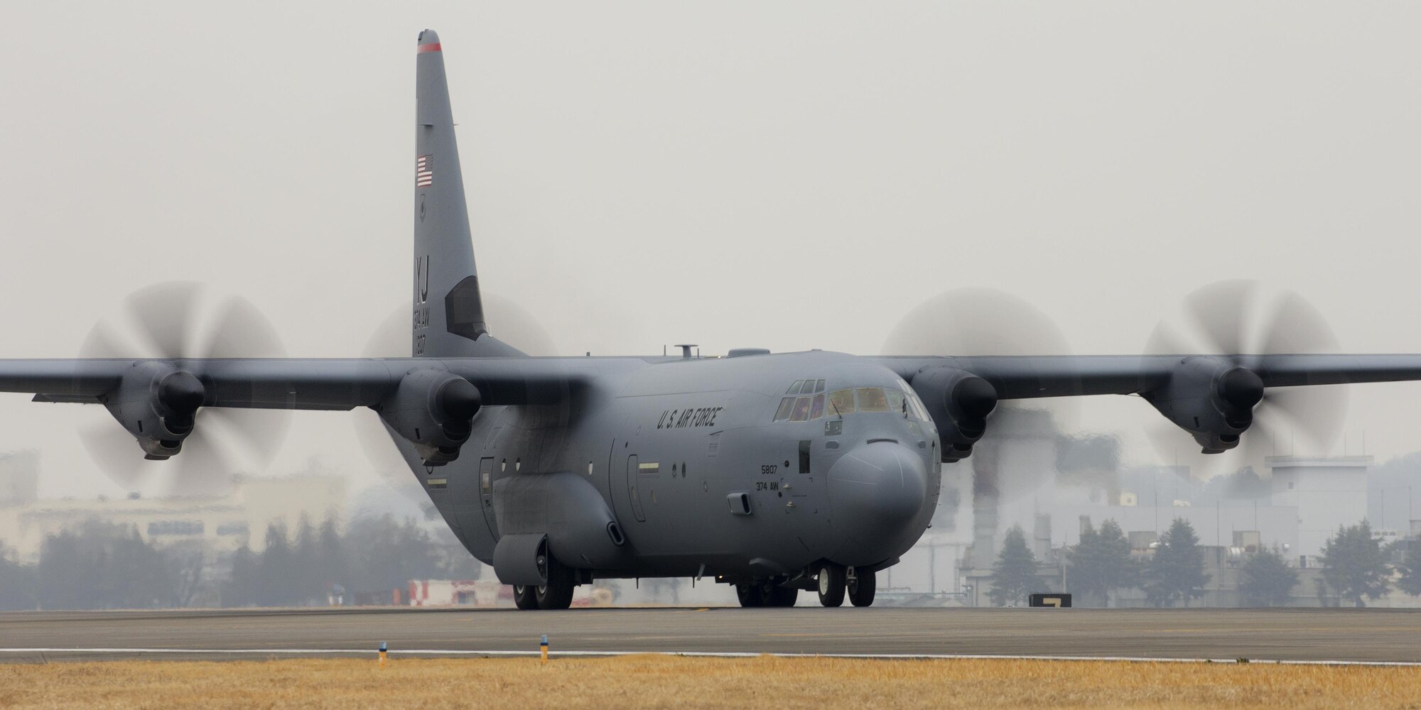 A C-130J Super Hercules taxies down a runway at Yokota Air Base, Japan, March 6, 2017. This is the first C-130J to be assigned to Pacific Air Forces. Yokota serves as the primary Western Pacific airlift hub for U.S. Air Force peacetime and contingency operations. Missions include tactical air land, airdrop, aeromedical evacuation, special operations and distinguished visitor airlift. (U.S. Air Force photo by Yasuo Osakabe)