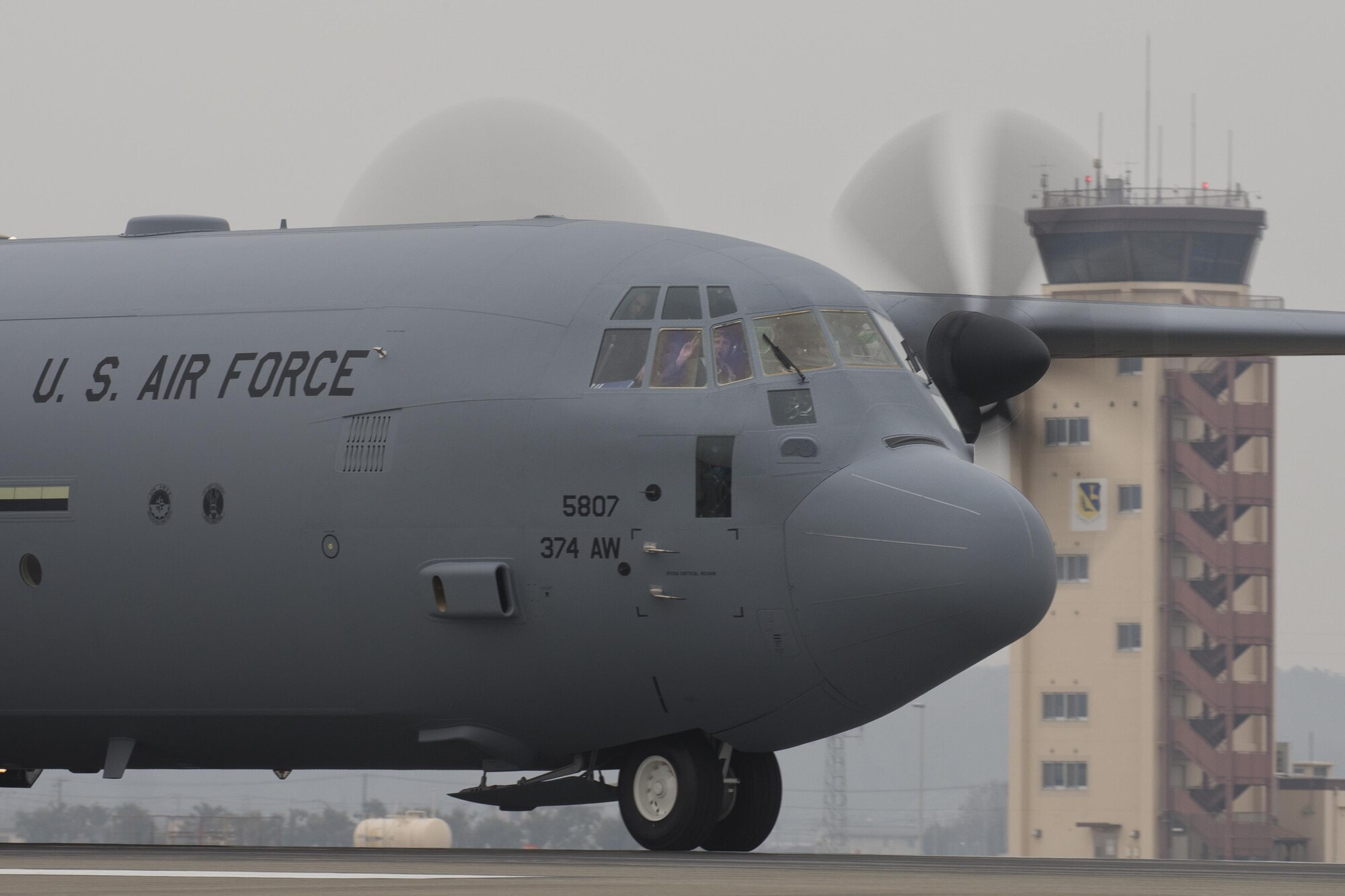 Maj. Jesse Klaetsch, 36th Airlift Squadron C-130J pilot, greets after touching down at Yokota Air Base, Japan, March 6, 2017. This is the first C-130J to be assigned to Pacific Air Forces. Yokota serves as the primary Western Pacific airlift hub for U.S. Air Force peacetime and contingency operations. Missions include tactical air land, airdrop, aeromedical evacuation, special operations and distinguished visitor airlift. (U.S. Air Force photo by Yasuo Osakabe)