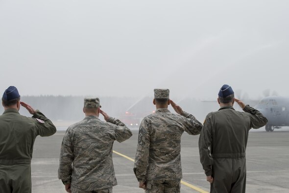 Base leadership salute the first C-130J Super Hercules to be assigned to U.S. Pacific Air Forces at Yokota Air Base, Japan, Mar. 6, 2017. The C-130Js will be used to support critical peacekeeping and contingency operations throughout the Indo-Asia Pacific region, including cargo delivery, troop transport, airdrop and aeromedical missions. (U.S. Air Force photo by Senior Airman David C. Danford)