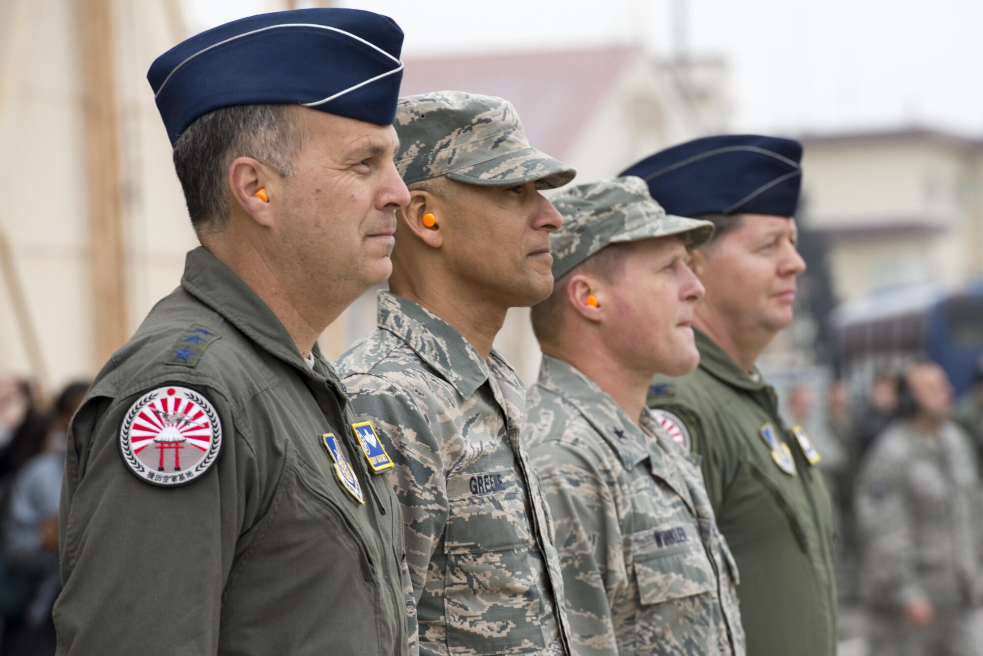 Lt. Gen. Jerry Martinez, U.S. Forces Japan and 5th Air Force commander, wears the new C-130J Super Hercules patch during a ceremony held to celebrate the arrival of Yokota's newest aircraft at Yokota Air Base, Japan, Mar. 6, 2017. The aircraft provides significant performance improvements and added operational capabilities that translate directly into increased effectiveness. (U.S. Air Force photo by Senior Airman David C. Danford)