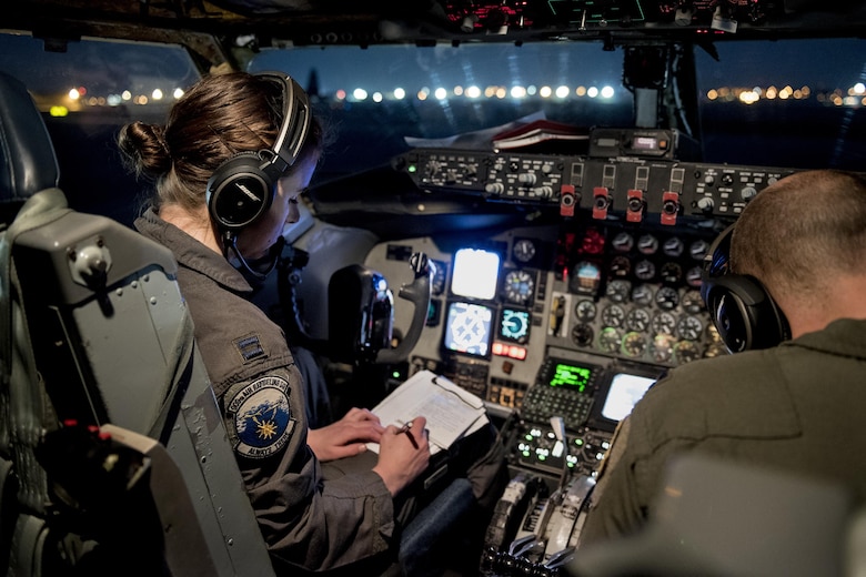 U.S. Air Force Captains Marissa Strauss and Tyler Branyan, 909th Air Refueling Squadron KC-135 Stratotanker pilots, conduct a preflight check prior to a sortie Feb. 27, 2017, at Kadena Air Base, Japan.  The 909th ARS supported the U.S. Navy aircraft carrier USS Carl Vinson (CVN-70) with training and refueling operations during the carrier’s regularly scheduled Western Pacific deployment with the Carl Vinson Carrier Strike Group as part of the U.S. Pacific Fleet-led initiative to extend the command and control functions of the U.S. 3rd Fleet in the Indo-Asia-Pacific region. (U.S. Air Force Photo by Staff Sgt. Peter Reft/Released)